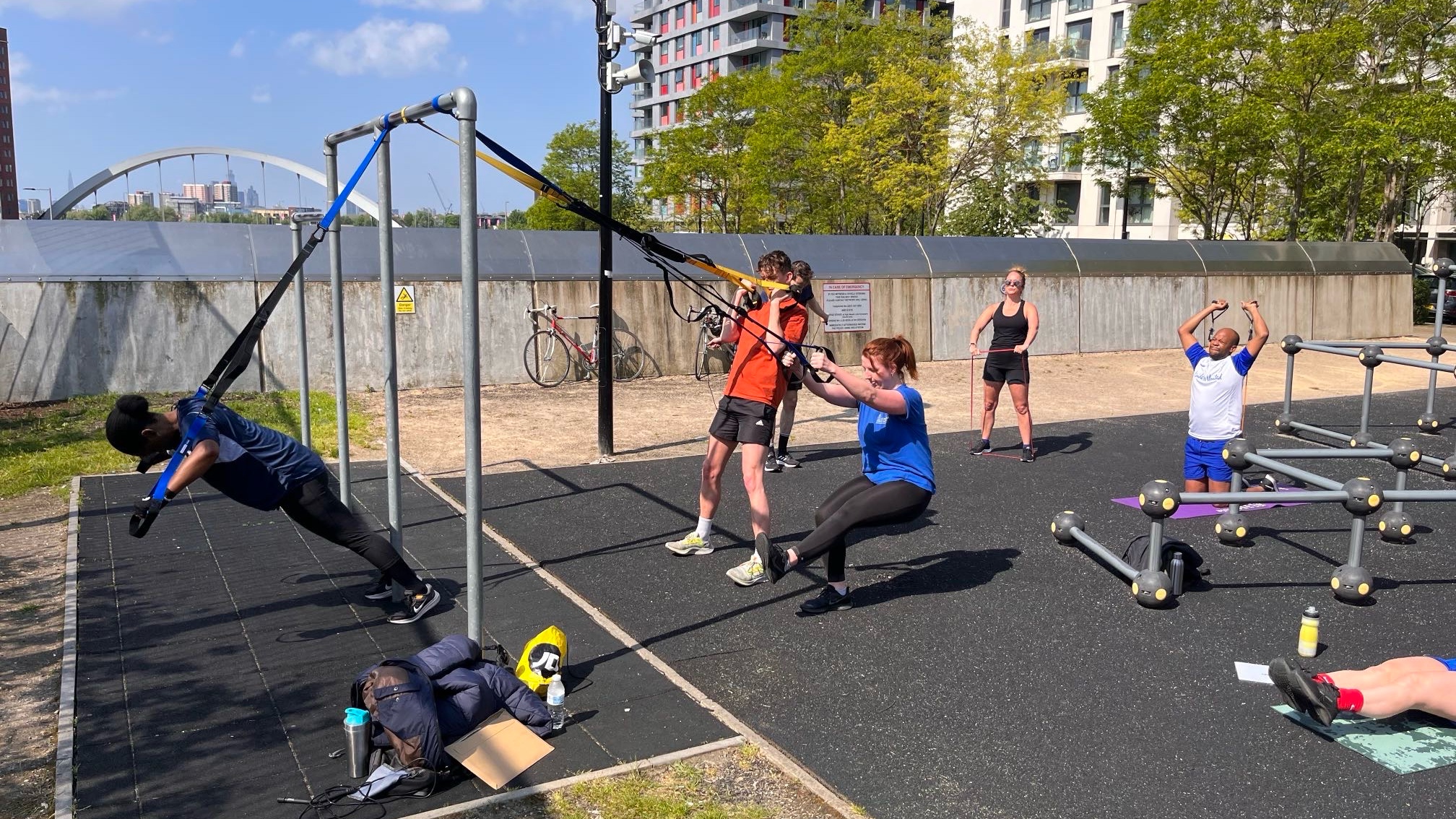 Group personal training session and outdoor bodyweight exercises at Victory Park East London